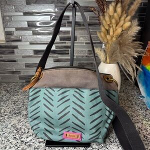 Fossil Keely Bucket Crossbody bag in a herringbone pattern on coated canvas